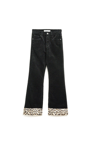 Black corduroy flare pants with leopard print at the bottom