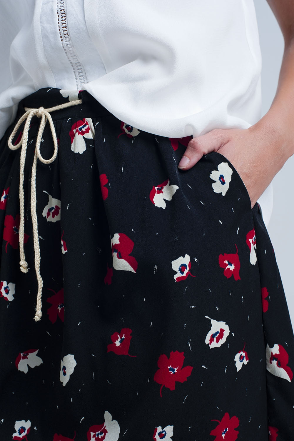 Black mini skirt with floral pattern Q2 Skirts BoutiqueLua