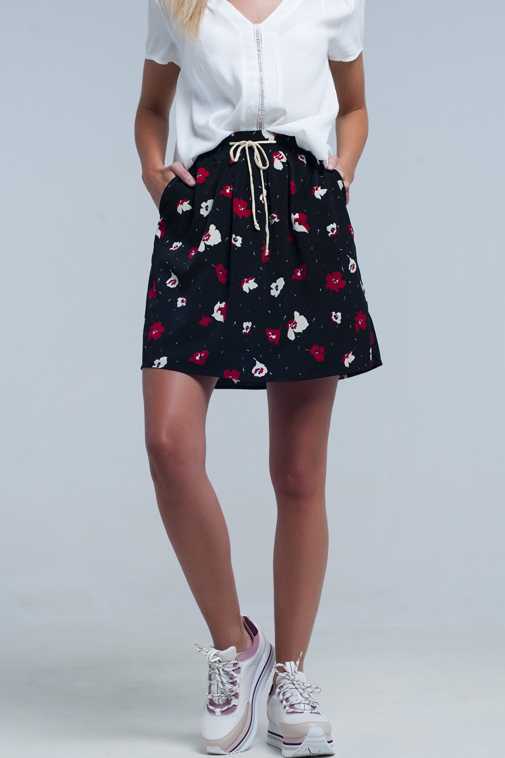 Black mini skirt with floral pattern Q2 Skirts BoutiqueLua