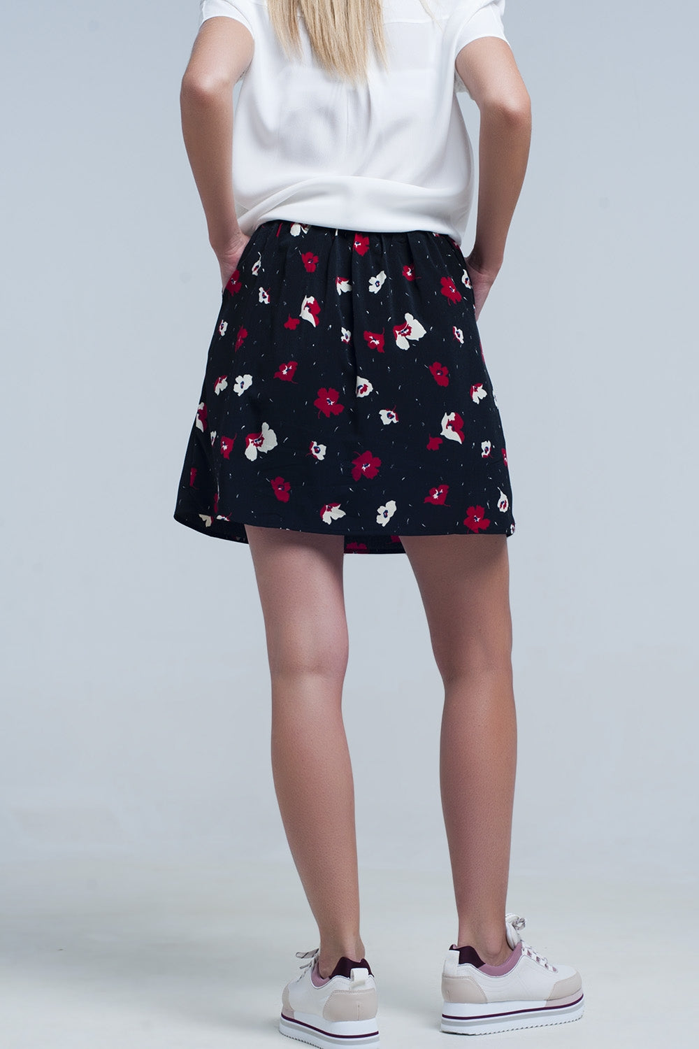 Black mini skirt with floral pattern Q2 Skirts BoutiqueLua