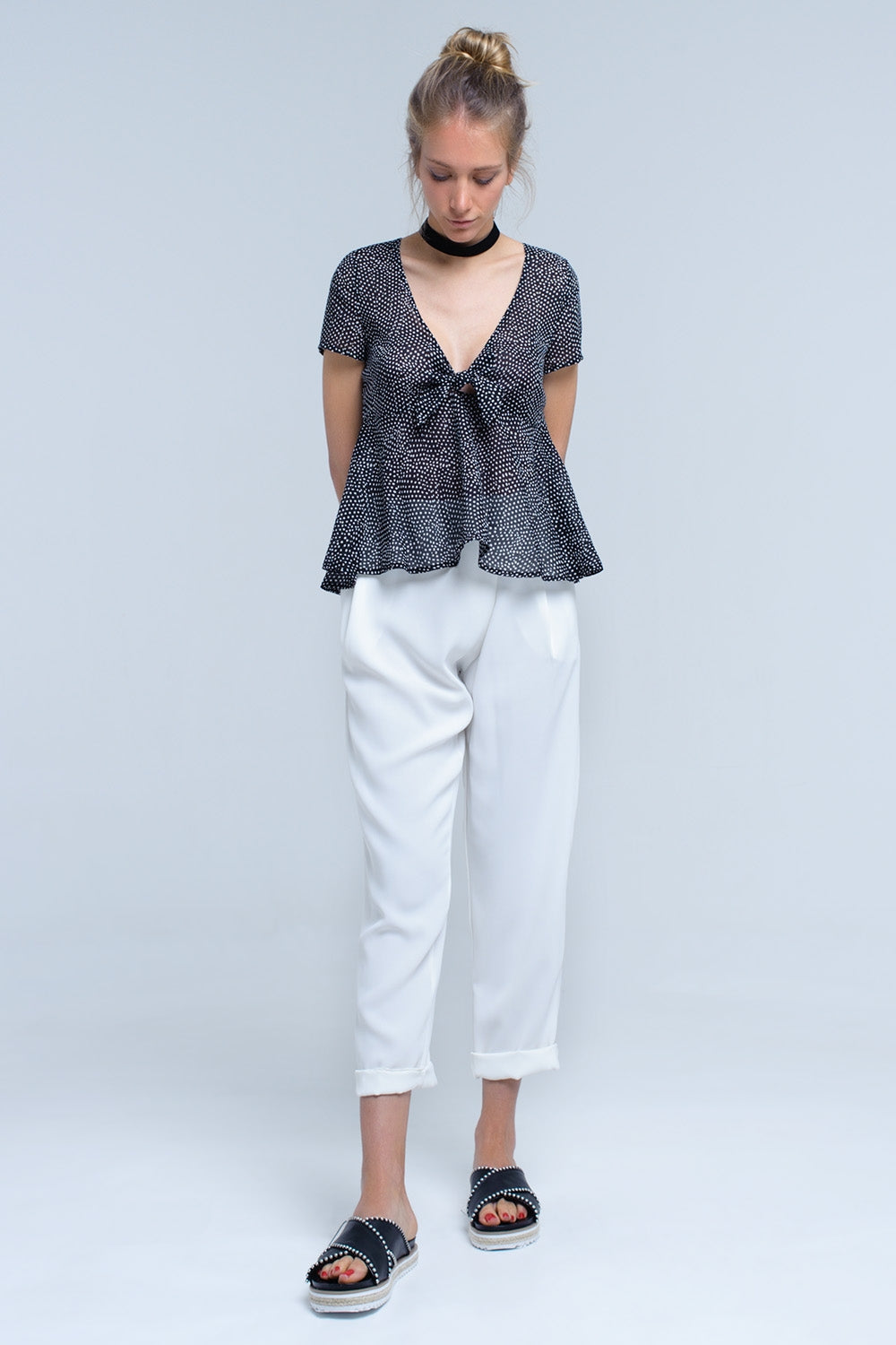 Black polka dot top with ruffle hem Q2 Shirts BoutiqueLua