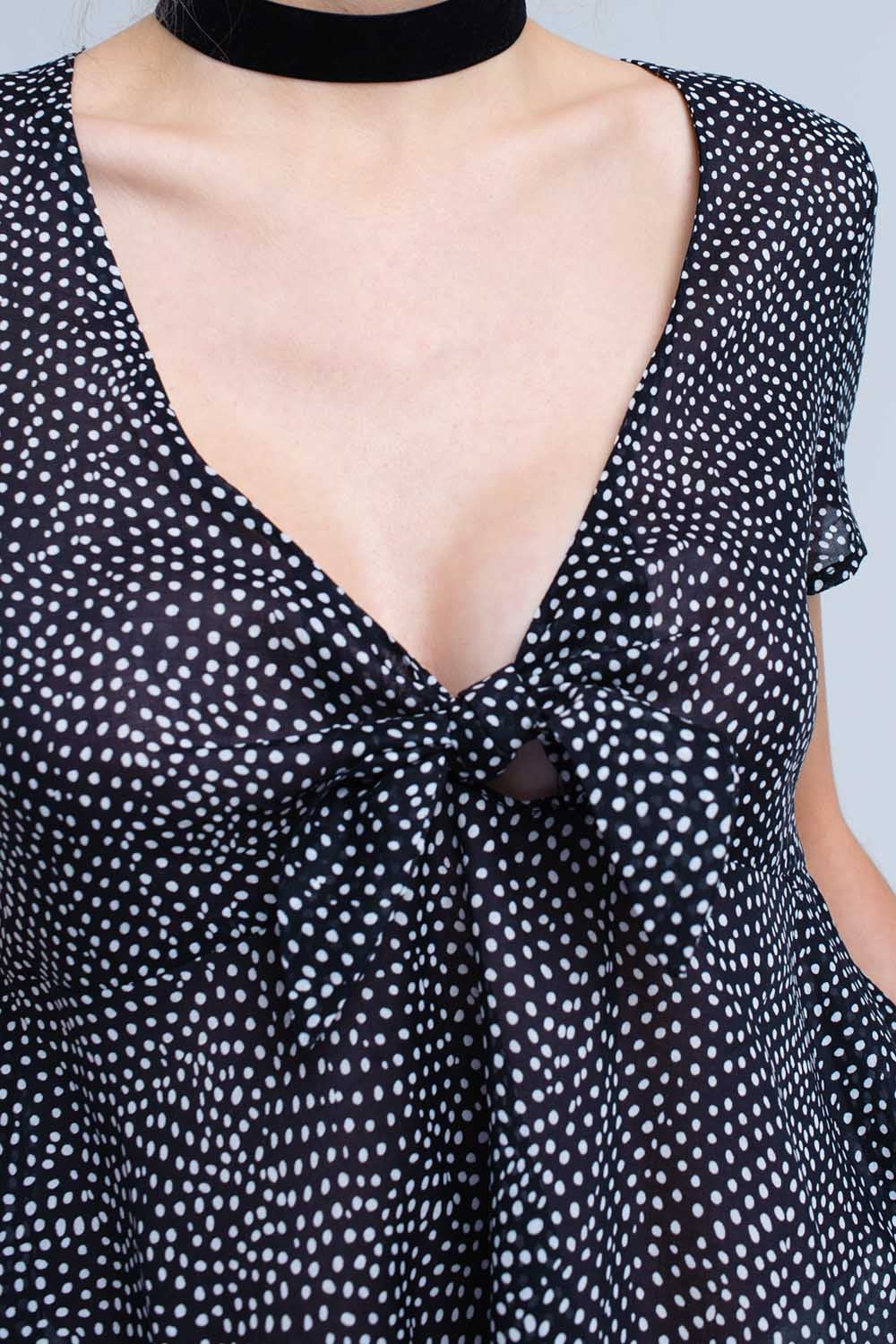 Black polka dot top with ruffle hem Q2 Shirts BoutiqueLua