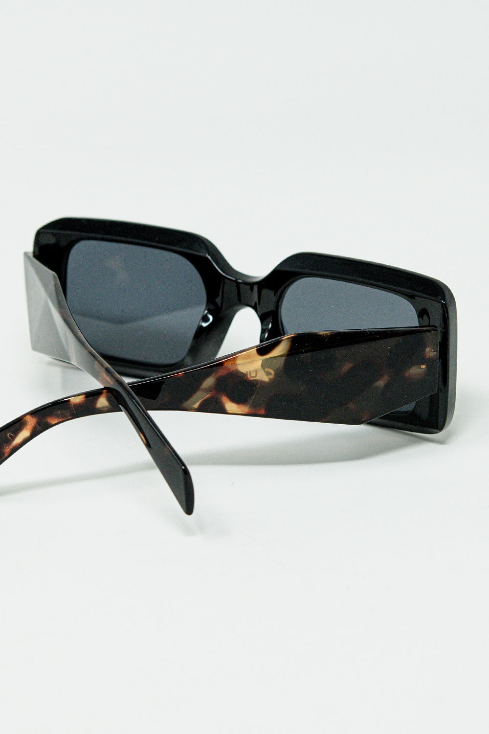 Black square sunglasses with brown animal print on the side