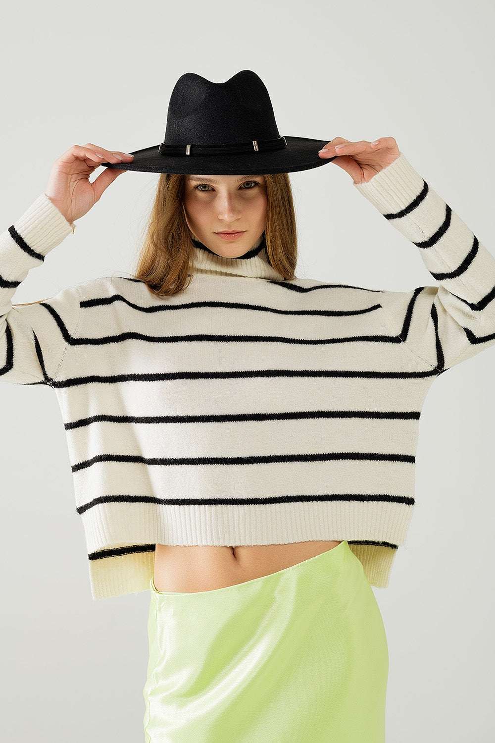 Cream striped sweater in black with high neck