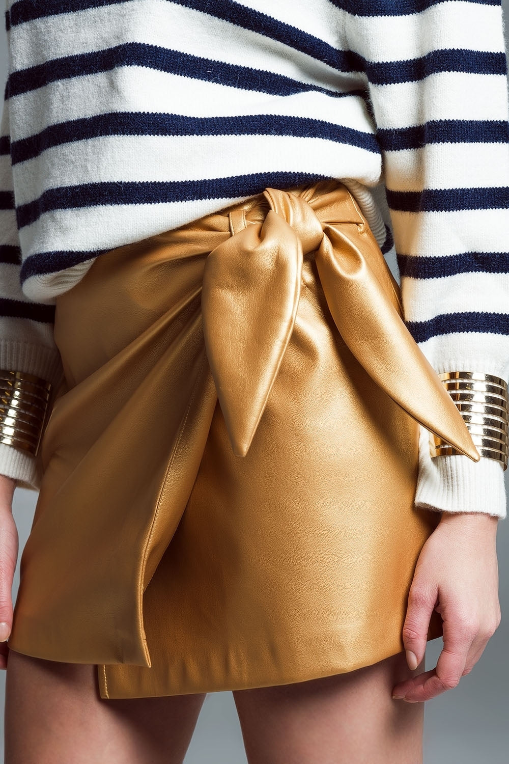 faux leather mini skirt with bow on the side in gold Q2 Skirts BoutiqueLua