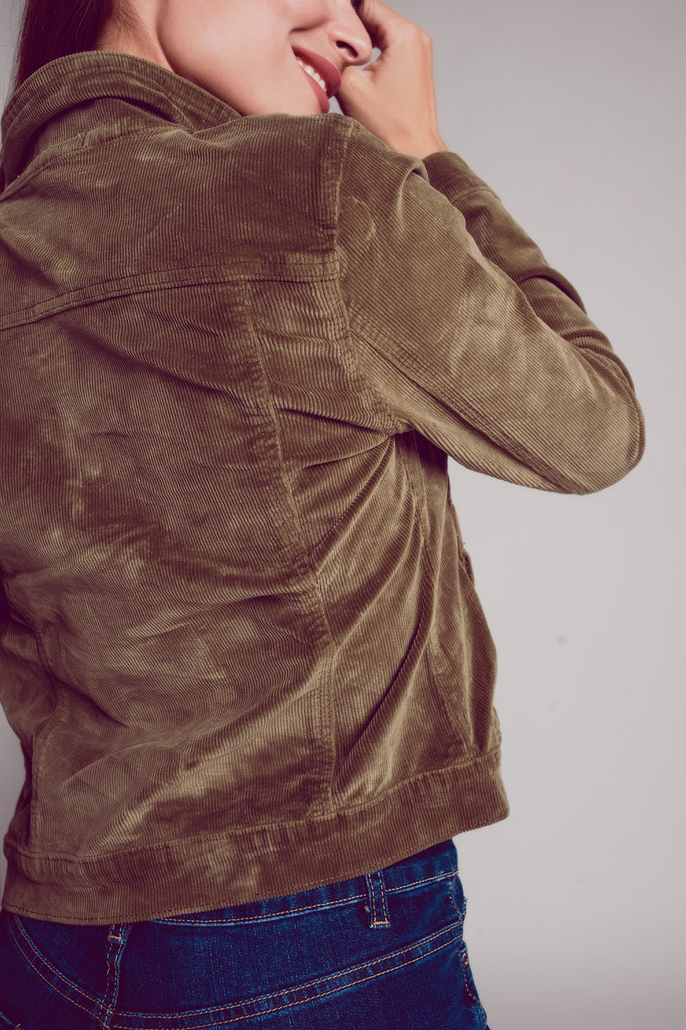 Khaki cropped cord jacket with a close-up view of the textured fabric and sleeve details.