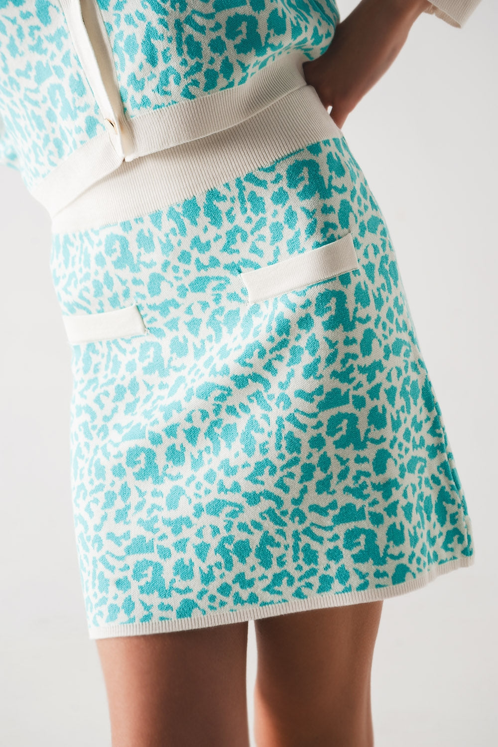 Lightweight knit mini skirt in turquoise animal print Q2 Skirts BoutiqueLua