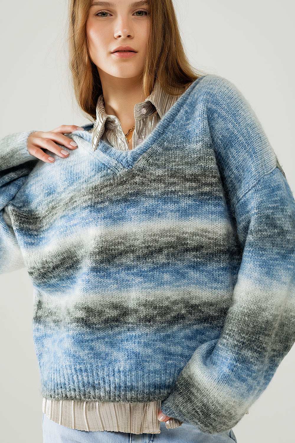 Loose V-neck sweater with blue and grey stripes