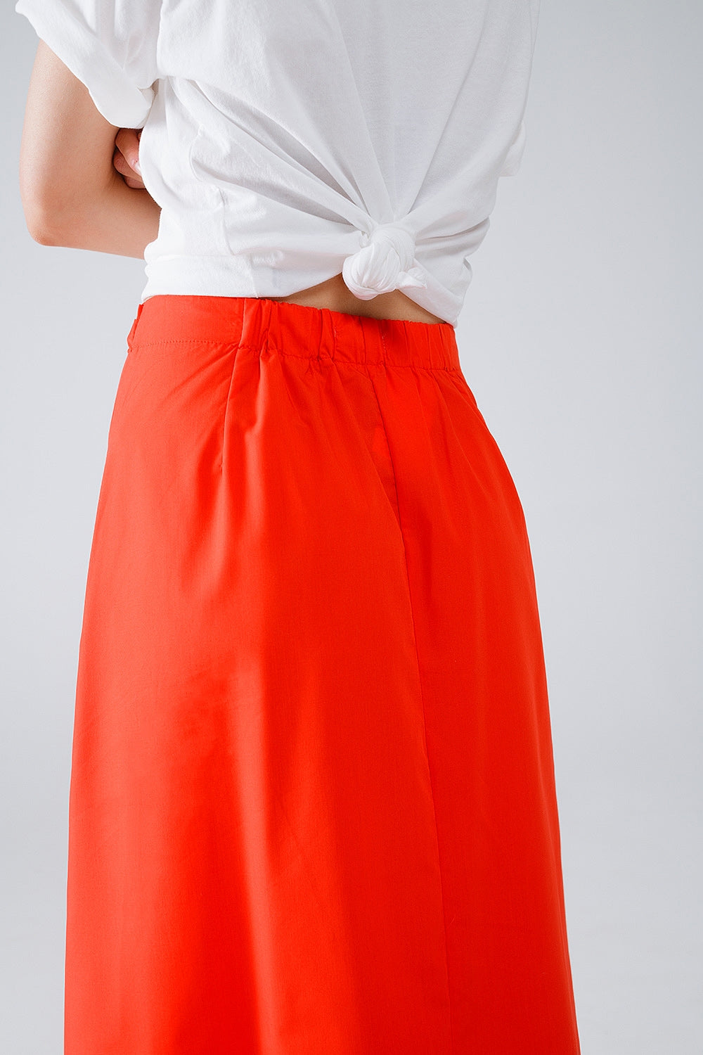 Maxi orange poplin skirt with knot detail at the waist Q2 Skirts BoutiqueLua