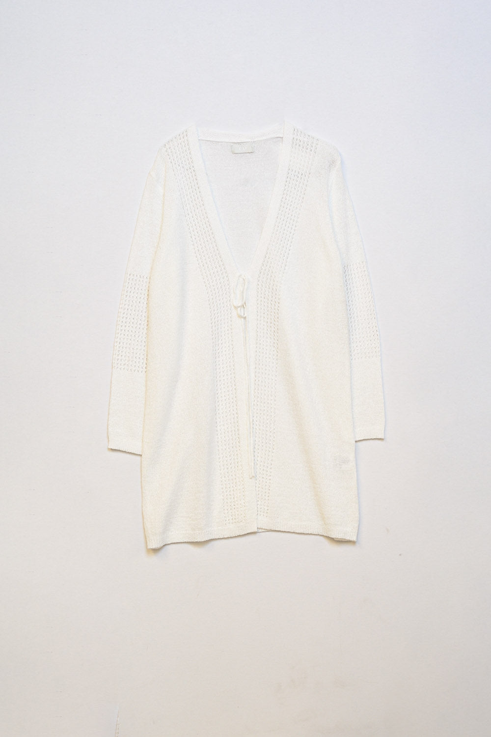 Relaxed fit white crochet cardigan with long sleeves and tie fastening.