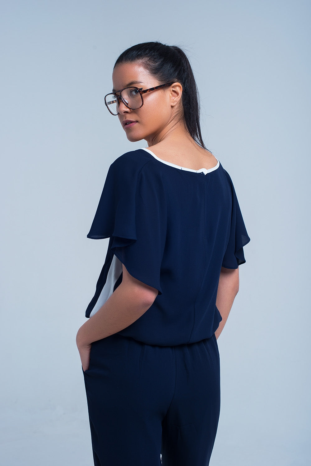 Navy blue jumpsuit with short sleeve and ruffle detail Q2 Dresses BoutiqueLua