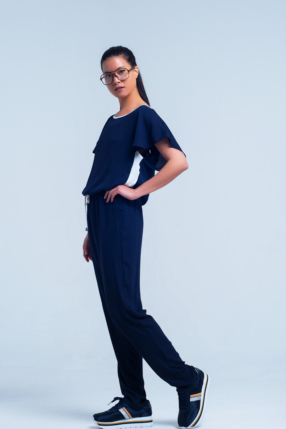 Navy blue jumpsuit with short sleeve and ruffle detail Q2 Dresses BoutiqueLua