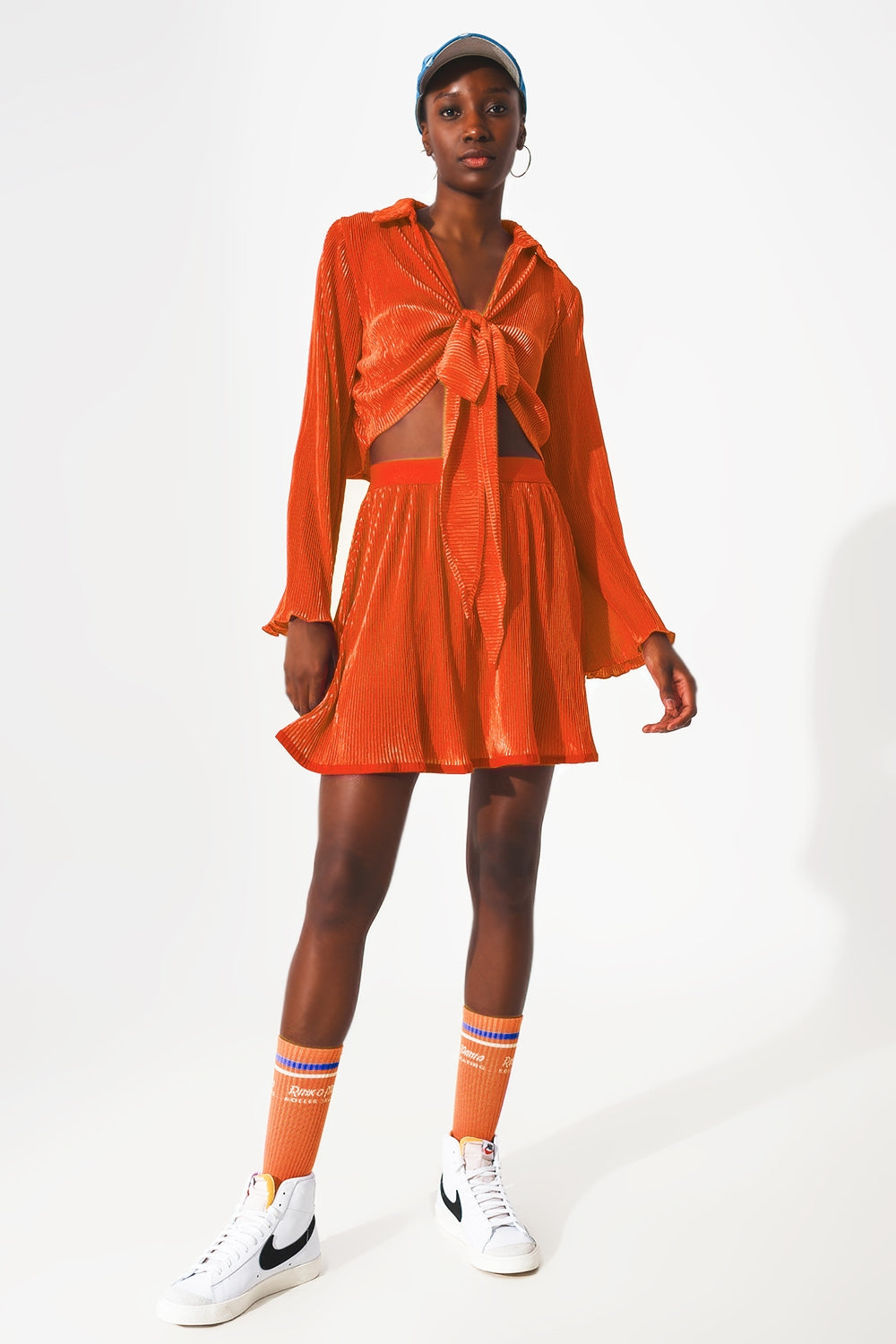 Pleated short skirt in orange Q2 Skirts BoutiqueLua