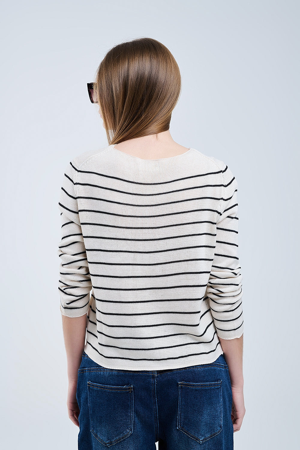 striped beige sweater made of fine knitting