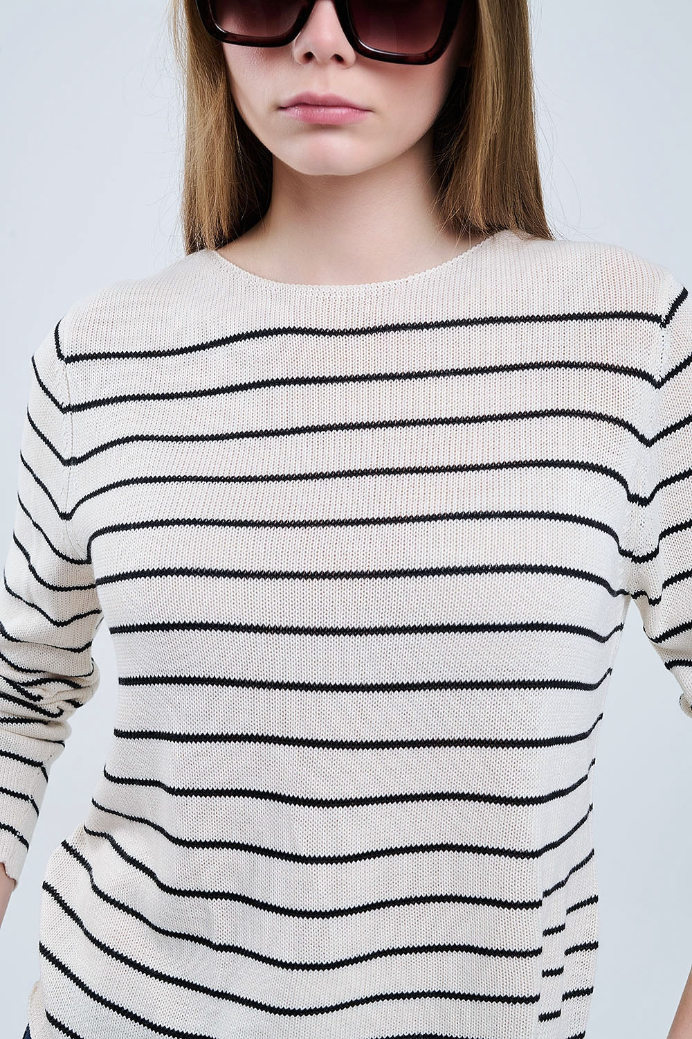 striped beige sweater made of fine knitting