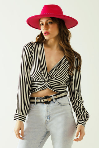 Striped crop top with V-neckline and twisted front in black and white.