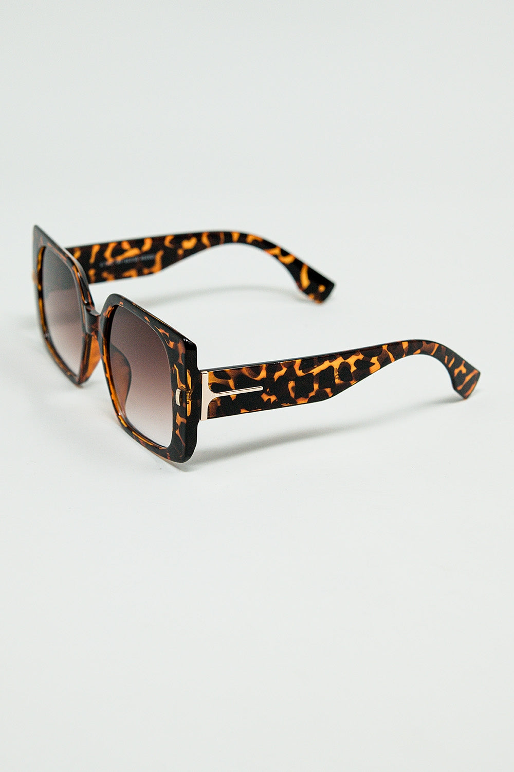 tiger print square sunglasses with gold detail on the side