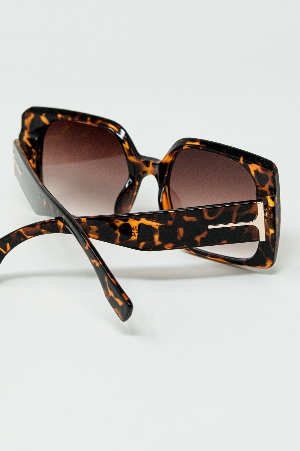 tiger print square sunglasses with gold detail on the side