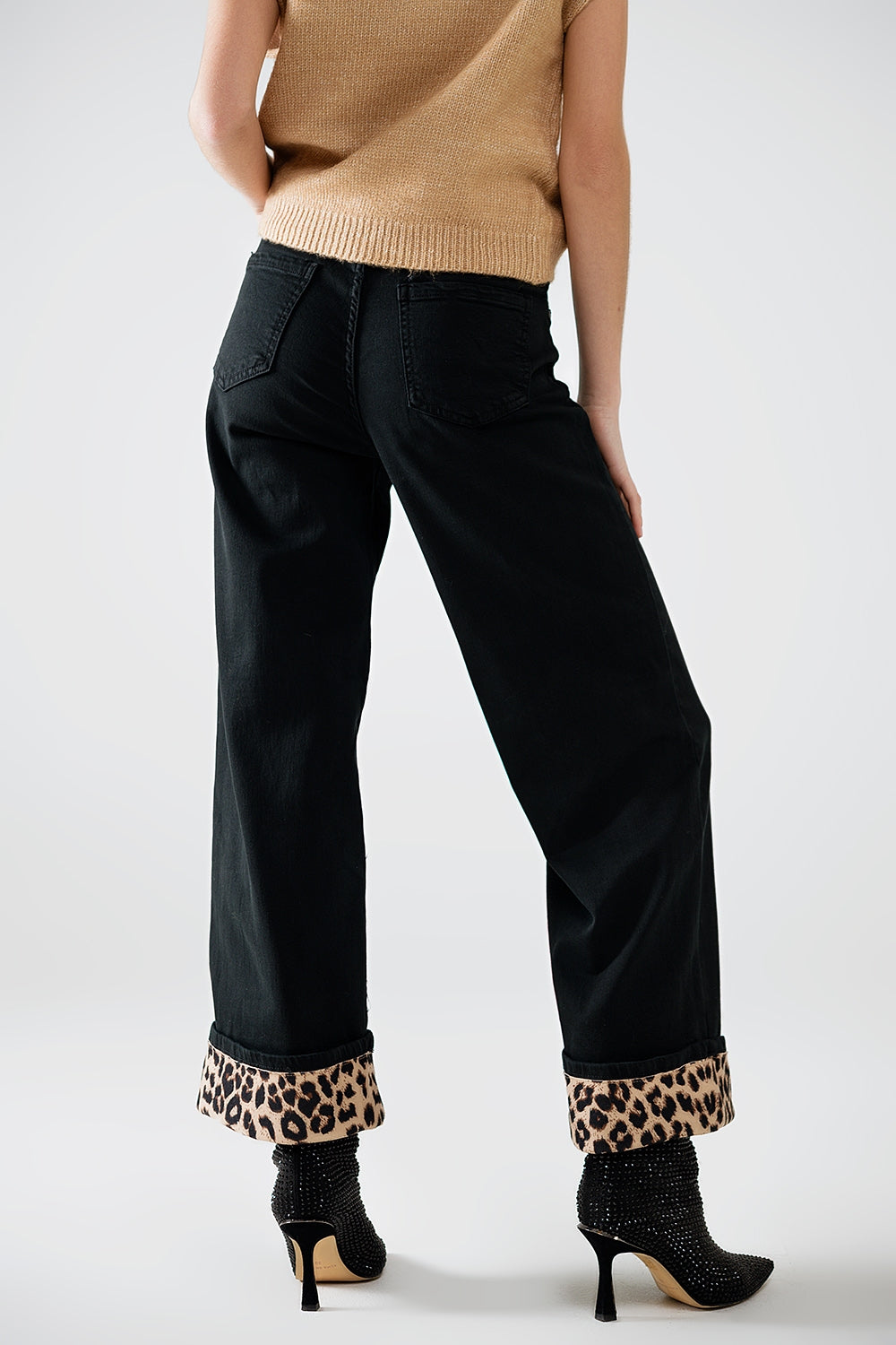 Wide leg black pants with leopard print at the bottom